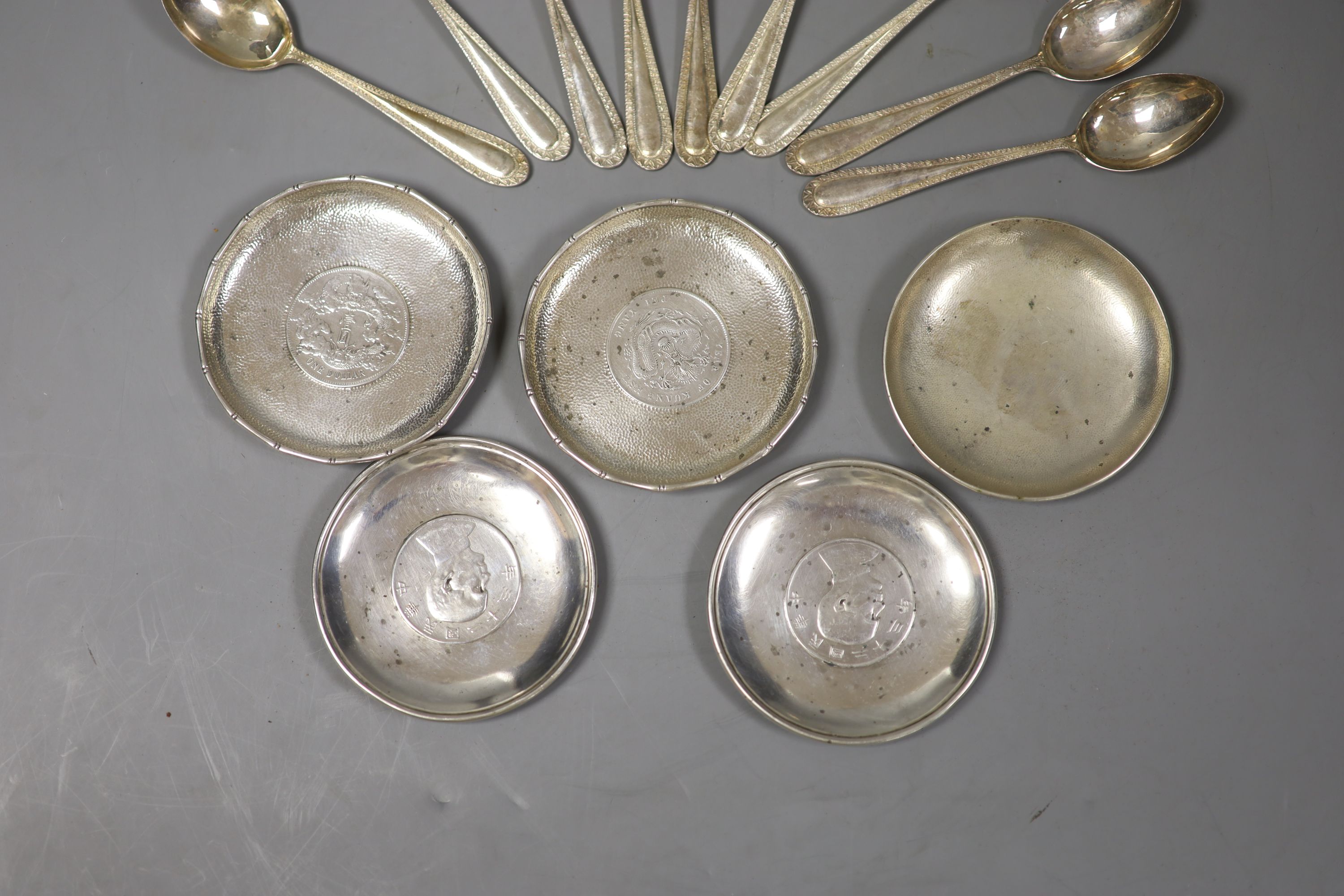 Small Chinese white metal items including inset coin dishes, teaspoons, posy vase and napkin ring.